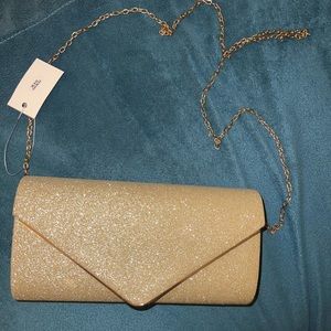 Gold crossbody clutch with strap